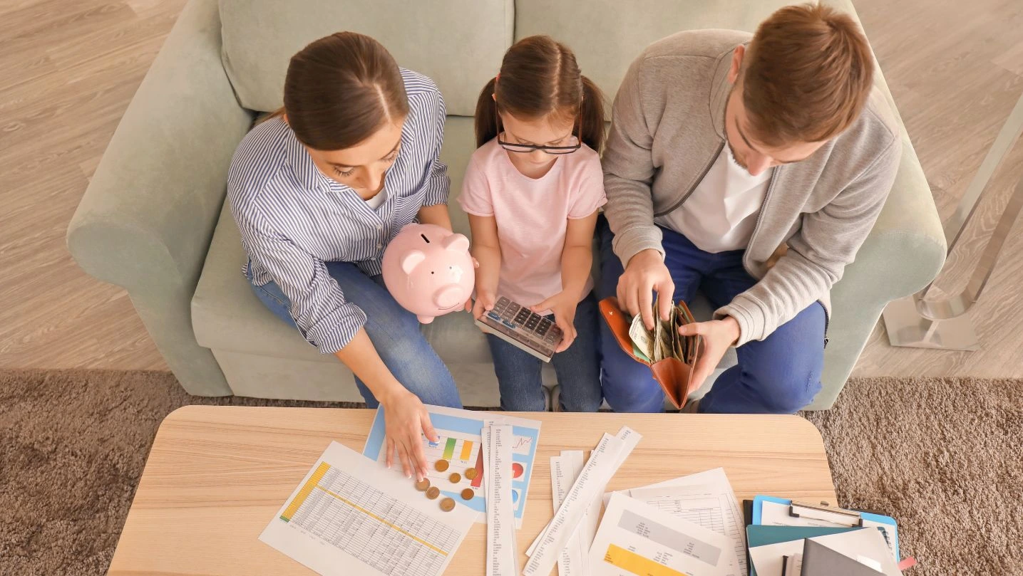 family-counting-money-indoors-money-savings-concept