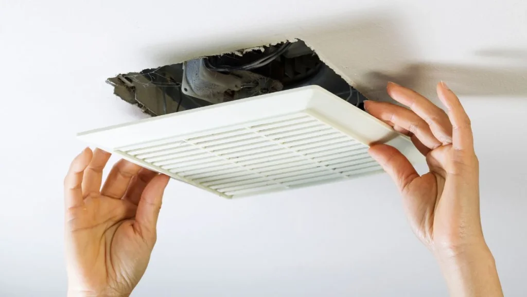 removing-bathroom-fan-vent-cover-to-clean-inside