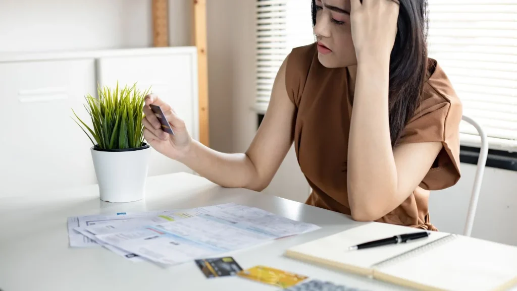 young-asian-woman-is-stressed-and-overthink-by-debt-from-many-credit-cards-and-bills