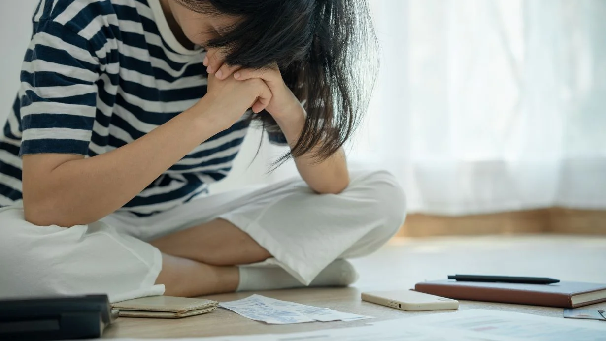 women-are-stressed-and-headaches-about-credit-card-debt